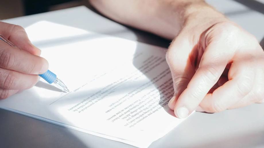 A director signing a company document
